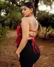 Vivacious Actress Yashika Aannand in a Red Sculptural Floral Top with Black Mini Skirt and Boots Photos 03