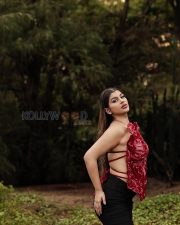 Vivacious Actress Yashika Aannand in a Red Sculptural Floral Top with Black Mini Skirt and Boots Photos 06