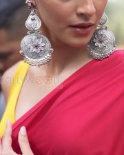 Vivid Actress Ananya Panday in a Red Saree with Yellow Sleeveless Blouse and Silver Jhumka Earrings Photos 01