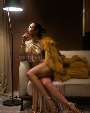 Voluptuous Malaika Arora in a Thigh High Slit Gold Crystal Gown Pictures 02