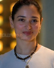 Winsome Actress Tamannaah Bhatia in a White Crew Neck T Shirt Layered Beaded Necklace Photos 02