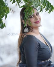 Winsome Yashika Aannand Cleavage in a Dark Navy Organza Saree Gold Paisley Motifs Black Deep V Blouse Photos 01