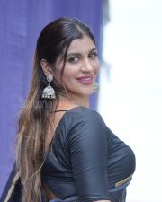 Winsome Yashika Aannand Cleavage in a Dark Navy Organza Saree Gold Paisley Motifs Black Deep V Blouse Photos 02