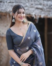 Winsome Yashika Aannand Cleavage in a Dark Navy Organza Saree Gold Paisley Motifs Black Deep V Blouse Photos 03