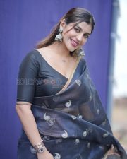 Winsome Yashika Aannand Cleavage in a Dark Navy Organza Saree Gold Paisley Motifs Black Deep V Blouse Photos 04
