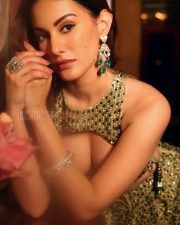 Actress Amyra Dastur in an Embellished Lehenga with a Halter Neck Crop Top Photos 01