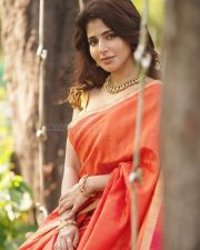 Adorable Iswarya Menon in an Orange Saree with a Golden Puff Blouse Photos 03