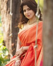 Adorable Iswarya Menon in an Orange Saree with a Golden Puff Blouse Photos 03