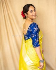 Anasuya Bharadwaj in a Bright Yellow Saree with a Royal Blue Blouse Pictures 04