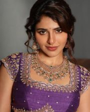 Appealing Iswarya Menon in a Vibrant Traditional Purple Lehenga Photos 02