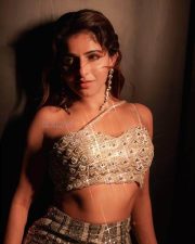Bazooka Heroine Iswarya Menon in a Shimmering Golden Embellished Sleeveless Bustier Top with a Matching Fishtail Lehenga Skirt Photos 04