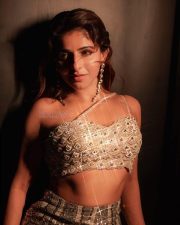 Bazooka Heroine Iswarya Menon in a Shimmering Golden Embellished Sleeveless Bustier Top with a Matching Fishtail Lehenga Skirt Photos 04