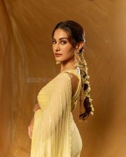 Beautiful Amyra Dastur in a Yellow Saree with a Yellow Metallic Sleeveless Blouse Photos 05