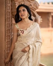 Beautiful Ritu Varma in an Off White Saree with Golden Detailing with a Floral Sleeveless Blouse Pictures 06