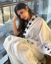 Bollywood Fashionista Mouni Roy in a White Saree with Black Blouse Pictures 02