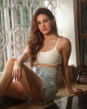 Charming Actress Amyra Dastur in a White Crop Cami Top and Denim Shorts Photos 01