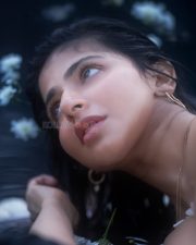 Chic Iswarya Menon in a White Cotton Sleeveless Top with Thin Spaghetti Straps Photos 02