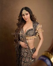 Dazzling Mouni Roy in a Black and Gold Lehenga Choli Photos 04