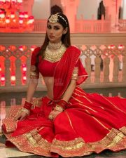 Dazzling Mouni Roy in a Red Wedding Lehenga Photos 01