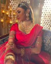 Dazzling Mouni Roy in a Red Wedding Lehenga Photos 06