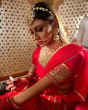 Dazzling Mouni Roy in a Red Wedding Lehenga Photos 07