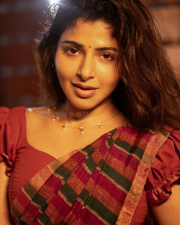Delightful Actress Iswarya Menon in a Red Checked Saree Puff sleeve Blouse Photos 04