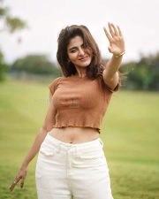 Desirable Iswarya Menon in a Brown Crop Top and White Denim Pants Photos 02