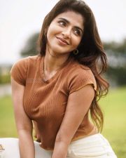 Desirable Iswarya Menon in a Brown Crop Top and White Denim Pants Photos 03