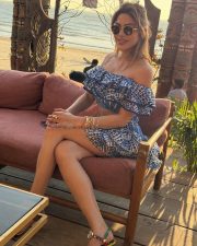 Desirable Nikki Tamboli in a Blue and White Off Shoulder Crop Top with a Layered Mini Skirt Pictures 02