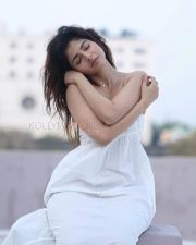 Enchanting Actress Iswarya Menon in a White Embroidered Spaghetti Strap Sundress Photos 01