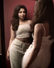 Enchanting Actress Iswarya Menon in a cream lace crop top and cream skirt photos 02