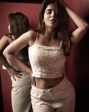 Enchanting Actress Iswarya Menon in a cream lace crop top and cream skirt photos 03