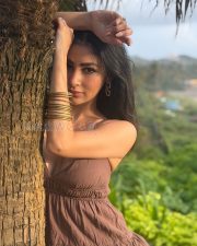 Enchanting Actress Mouni Roy in a Brown Strapless Mini Dress Photos 01