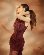 Enchanting Actress Mouni Roy in a Burgundy Ruched Lace Bodycon Dress Photos 01