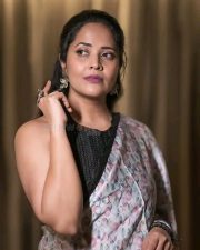 Flashback Actress Anasuya Bharadwaj in a Floral Printed Saree with a Stylish Black Sleeveless Blouse Photos 01