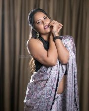 Flashback Actress Anasuya Bharadwaj in a Floral Printed Saree with a Stylish Black Sleeveless Blouse Photos 02