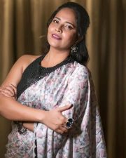 Flashback Actress Anasuya Bharadwaj in a Floral Printed Saree with a Stylish Black Sleeveless Blouse Photos 03