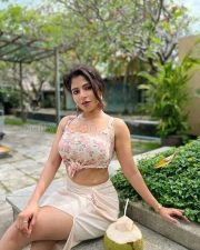 Gorgeous Iswarya Menon in a Floral Pink Knotted Top and Cream Thigh Slit Skirt Photos 01