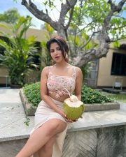 Gorgeous Iswarya Menon in a Floral Pink Knotted Top and Cream Thigh Slit Skirt Photos 02