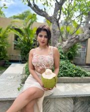 Gorgeous Iswarya Menon in a Floral Pink Knotted Top and Cream Thigh Slit Skirt Photos 03