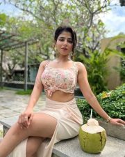 Gorgeous Iswarya Menon in a Floral Pink Knotted Top and Cream Thigh Slit Skirt Photos 04