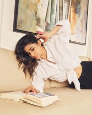 Grace and Glamour Mouni Roy in a Classic Tied Up White Shirt and Black Pants Photos 01