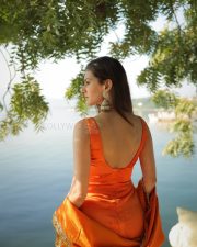 Graceful Actress Amyra Dastur in an orange embroidered silk sleeveless blouse photos 01