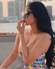 Hot Mouni Roy in a Cleavage Baring Short Floral Dress Photos 02