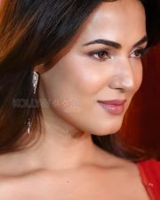 Hot Sonal Chauhan in a Red Saree with a Sequined Sleeveless Blouse Photos 03