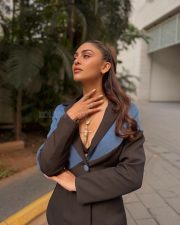 Jaageer Actress Krystle DSouza in a Black and Blue Single Breasted Blazer with Matching Flared Pants Photos 02
