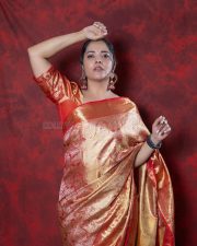 Kollagottinadhiro Actress Anasuya Bharadwaj in a Traditional Red and Gold Kanchipuram Silk Saree with a Matching Red Silk Blouse Pictures 04
