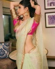 Mesmerizing Actress Mouni Roy in a vibrant fuchsia and cream embroidered lehenga choli with sheer drape photos 06