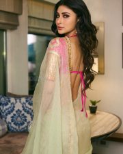 Mesmerizing Actress Mouni Roy in a vibrant fuchsia and cream embroidered lehenga choli with sheer drape photos 08