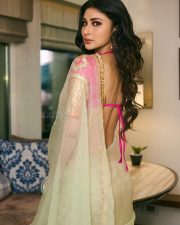 Mesmerizing Actress Mouni Roy in a vibrant fuchsia and cream embroidered lehenga choli with sheer drape photos 08